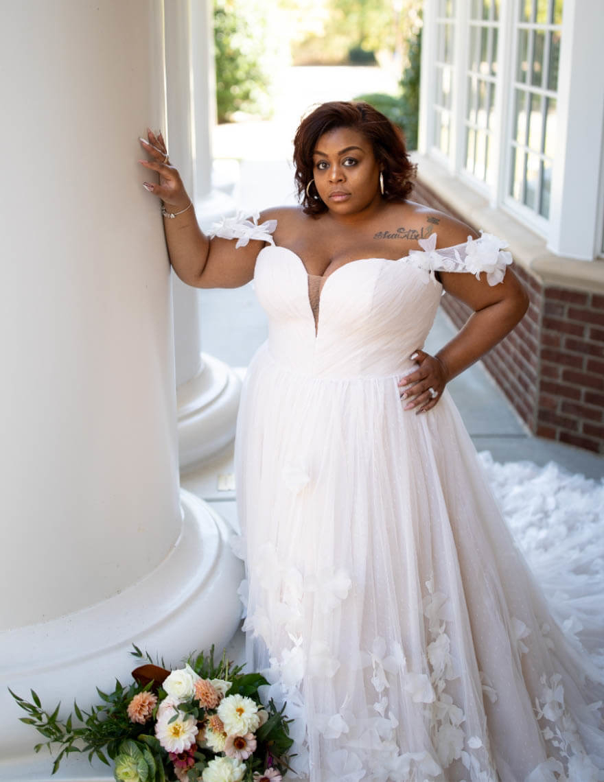 Model wearing a plus size bridal gown
