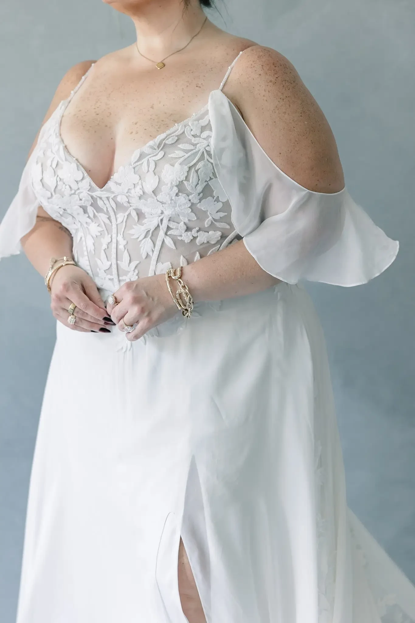 model wearing a plus size wedding gown