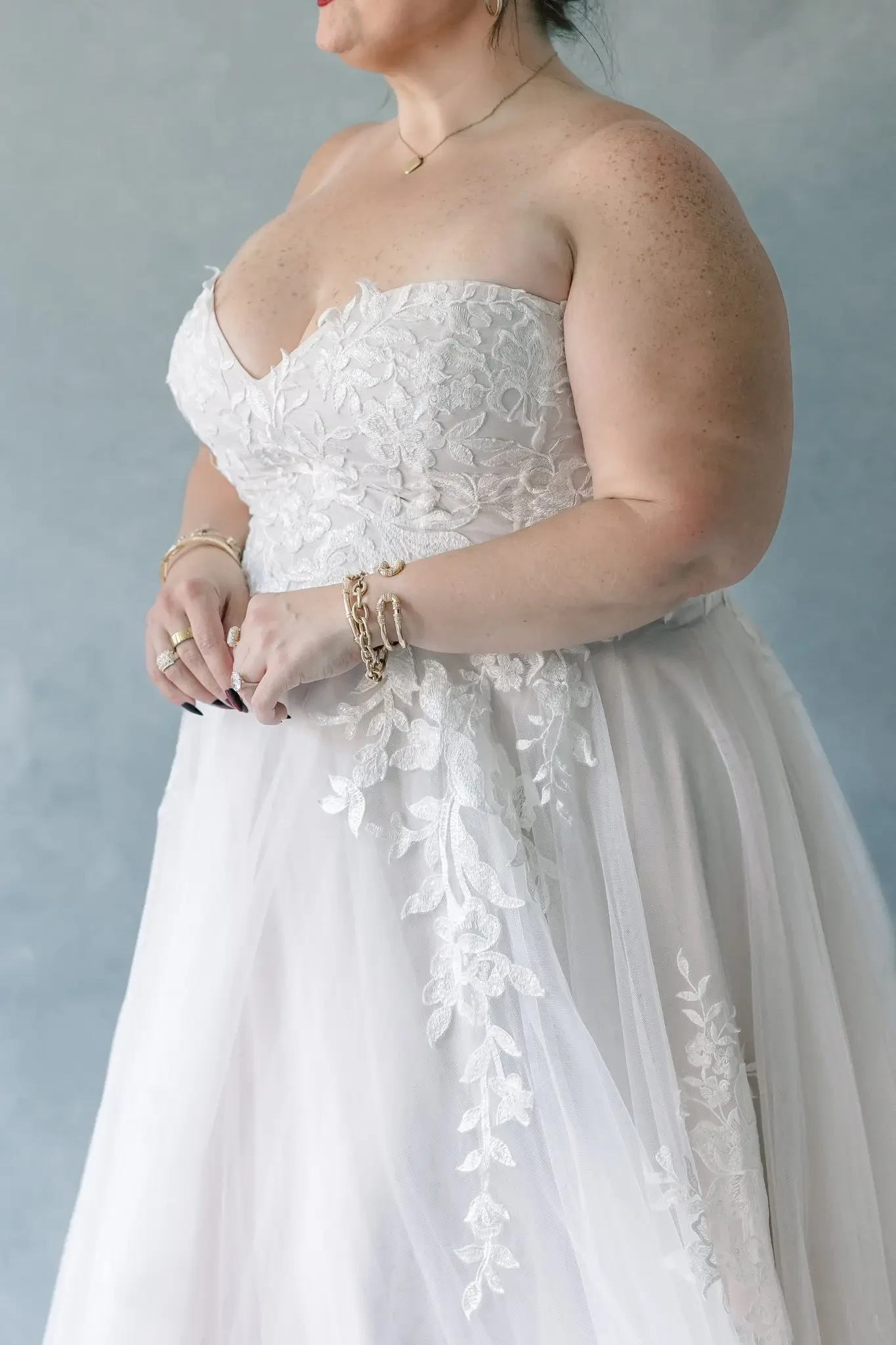 model wearing a plus size wedding gown