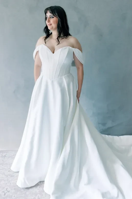model wearing a plus size wedding gown