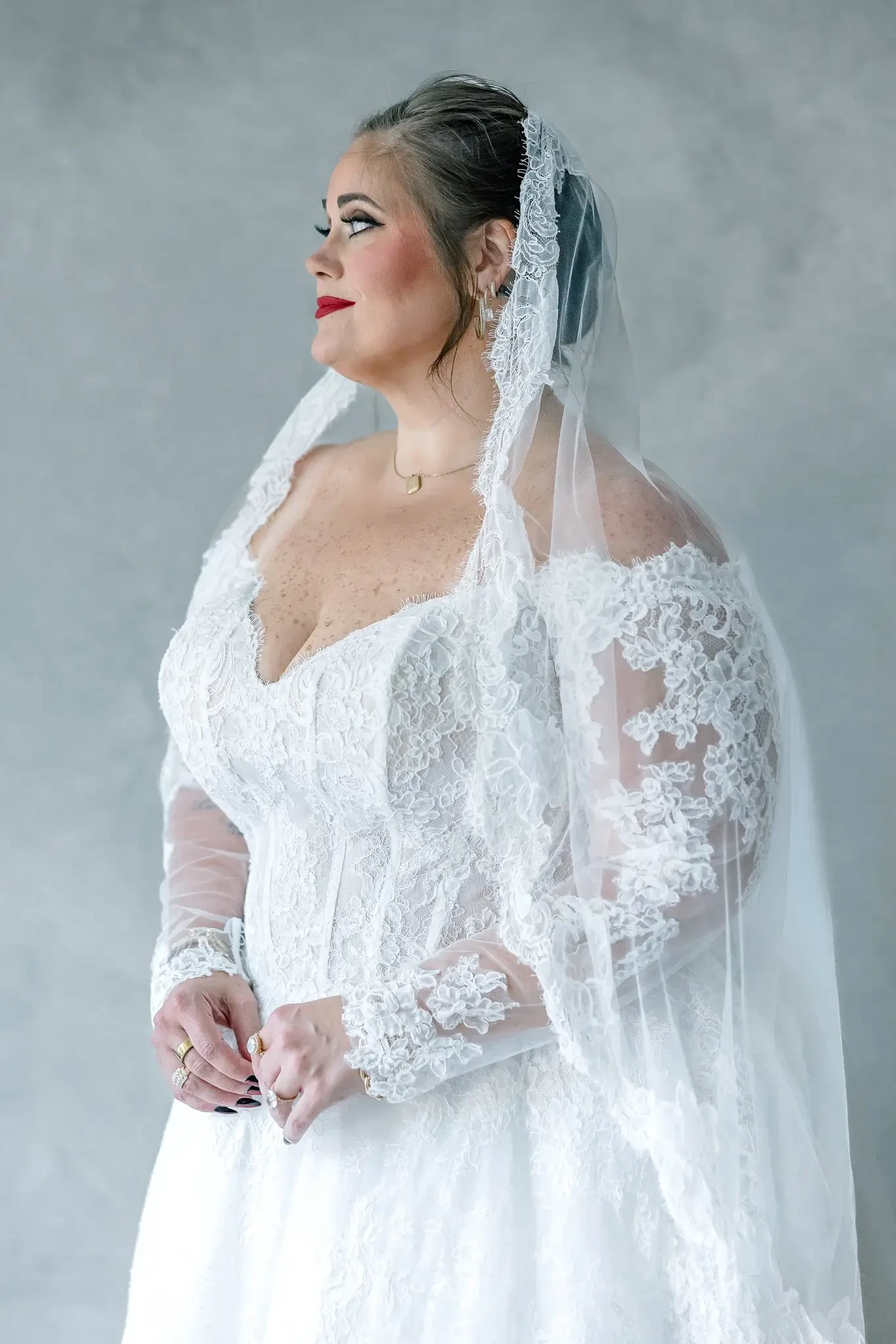 model wearing a plus size wedding gown