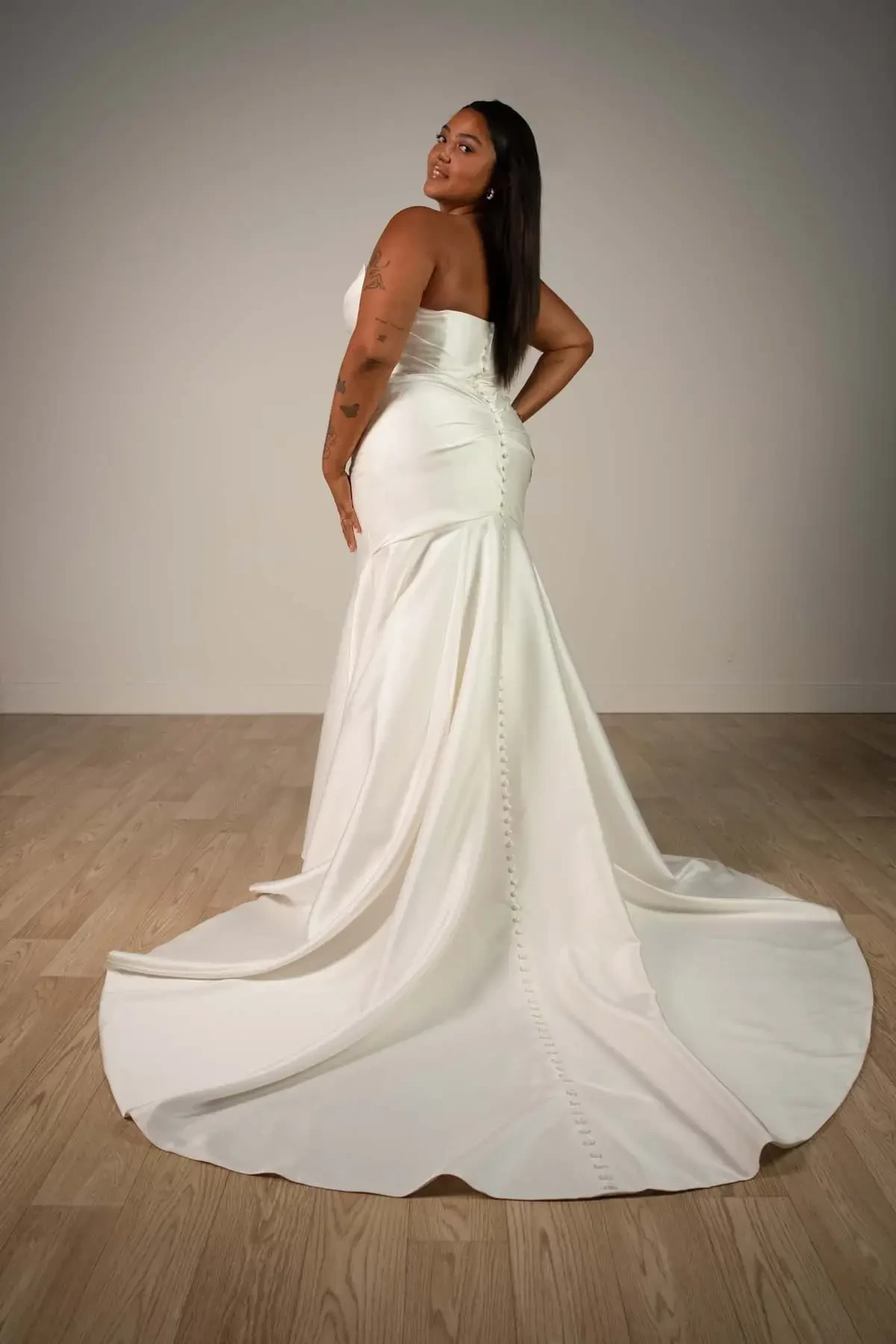 model wearing a plus size wedding gown